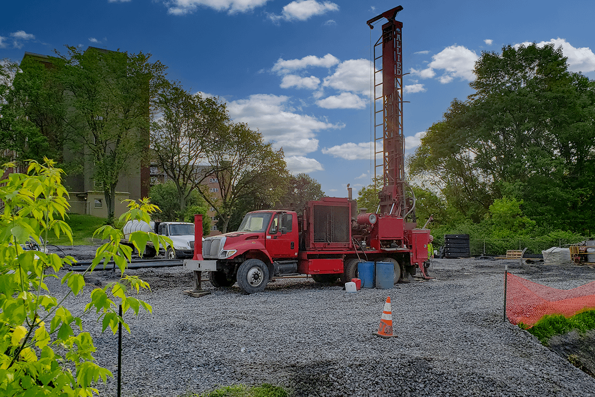 Colonial II Geothermal A geothermal drilling rig drilling into the ground to create a well.